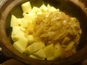 Then the potatoes and onions and spices in water.